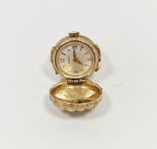 Vintage Tissot watch face mounted in a yellow metal ring, with metal dial cover, the case back