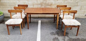 Mid-century teak extending dining table and six chairs, with internal fold out extension, possibly