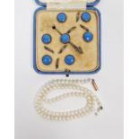 String of small pearls on 9ct gold clasp and a set of six blue enamel and silver-coloured metal