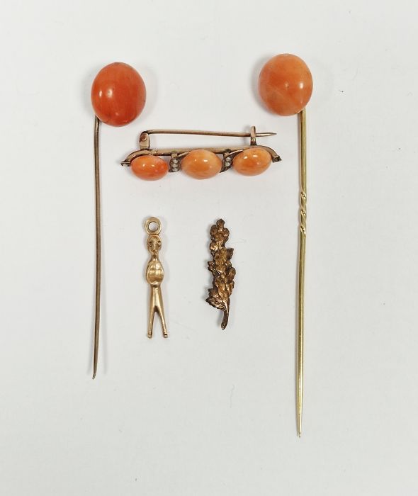 Gold coloured, coral and seedpearl bar brooch, two gold-coloured metal and coral stickpins, an