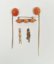 Gold coloured, coral and seedpearl bar brooch, two gold-coloured metal and coral stickpins, an