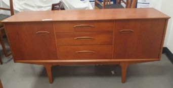 Mid century Jentique teak sideboard, the three graduating central drawers flanked by cupboards,