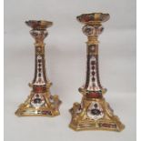 Pair of Royal Crown Derby bone china imari pattern candlesticks, printed iron red marks, pattern