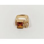 14K gold and orange stone ring of modernist form set rectangular single stone in stepped bark-