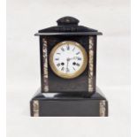 Victorian black slate mantel clock of architectural form, white dial with roman numerals flanked