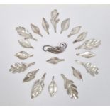 Danish Eiler & Merloe sterling seedpod and foliate brooch and a quantity of white metal leaf-shapes,