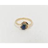 14ct gold and opal doublet ring set small oval stone in pierced setting