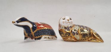 Two Royal Crown Derby bone china animal paperweights, the first 'Moonlight Badger' from the