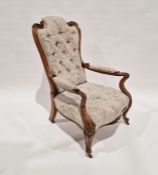 Victorian carved walnut-framed upholstered open arm elbow chair, on scroll carved cabriole supports