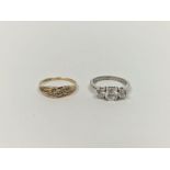 Silver three-stone dress ring set with three white stones and a 9ct gold and diamond ring,