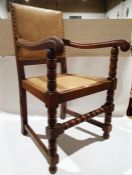 Oak open armchair with studded back bobbin supports.