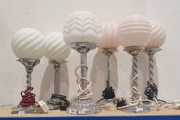 Six early/mid 20th century chromium plated table lamps with shaped glass spherical shades (6)