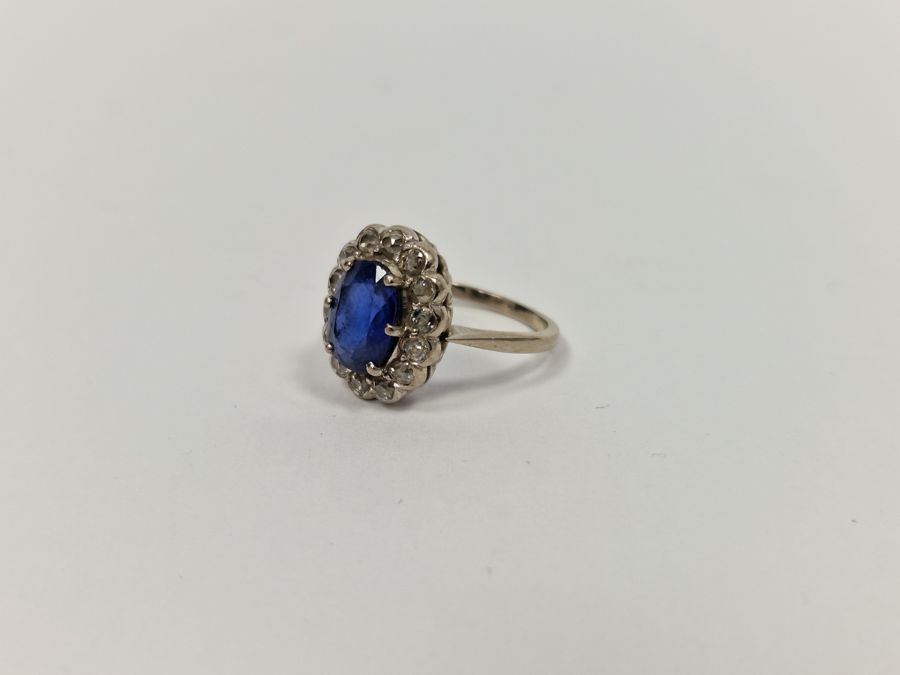 18ct white gold, sapphire and diamond cluster ring, the oval sapphire 2.3ct approx., the diamonds - Image 2 of 2