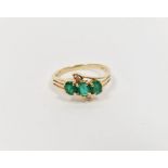14ct gold, emerald and diamond dress ring set three oval emeralds and two small diamonds