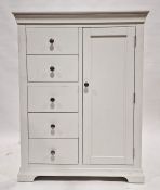 Modern white painted storage unit comprising a bank of five short drawers on one side and a large