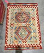 Chobi beige ground kilim with two central stepped lozenge medallions, multiple geometric borders