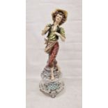 20th century Italian pottery figure of a woman wearing a wide brim hat, curly brown hair, black