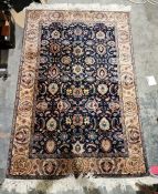 Eastern style blue ground rug with floral field, multiple floral borders 184cm x 123cm