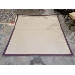 Large modern beige ground rug with purple exterior band, 202cm x 200cm