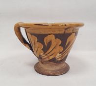 19th century Staffordshire pottery slipware conical bowl, decorated in cream slip with band of