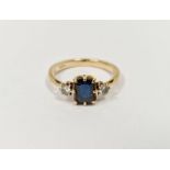 9ct gold, sapphire and diamond ring, the rectangular sapphire flanked by two claw-set diamonds