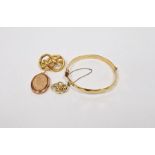 Gold-coloured metal small knot brooch with engraving, another gilt-metal knot-pattern brooch, a