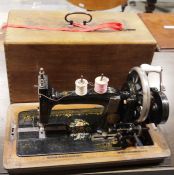 Vintage Naumann sewing machine housed in wooden case