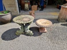 Reconstituted small garden table supported by three stylised dolphins, 56cm diameter x 52cm high and