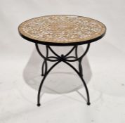 Metal-framed circular garden table with mosaic stone top