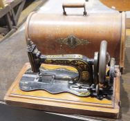Vintage Singer sewing machine with wooden case