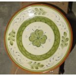 Slipware charger, two Wedgwood blue jasperware dishes, a carved hardwood African figure, a brass