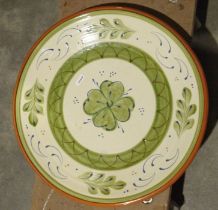 Slipware charger, two Wedgwood blue jasperware dishes, a carved hardwood African figure, a brass