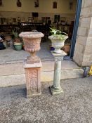 Two classical style urns on plinths in reconstituted stone, one on greek-style column, 105cm, the