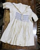 Vintage childs cotton dress with blue smocking to bodice