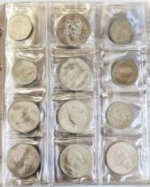 Large collectors folder containing coins from UK various denominations, Ireland, Germany, Jersey,