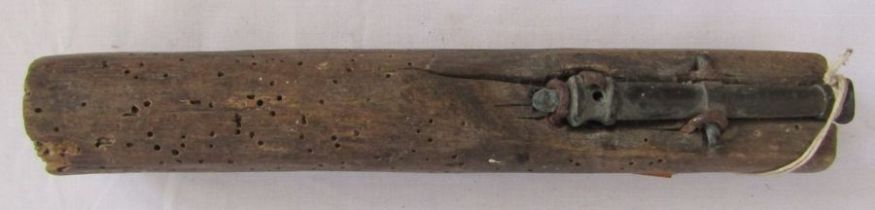 Early 19th century miniature brass cannon mounted to be held in the hand.