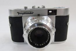 Voigtlander Vito B camera, two Braun Paxette cameras, an Argus Cintar F3.5-50mm camera and many
