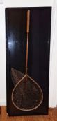 Cased vintage fishing net with wooden frame and brass mounts and a split cane four-section fishing