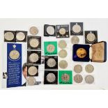 Box of commemorative crowns (21), a Tower of London commemorative medallion and five pounds (4).