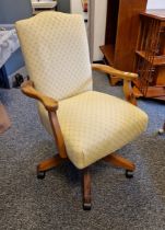 Modern pine upholstered revolving office chair together with another modern office chair, largest