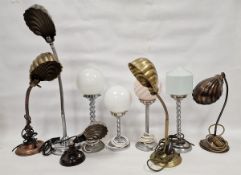 Nine vintage table lamps, including five gooseneck lamps with shell-shaped shades, three with