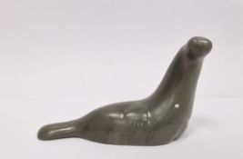 Carved Inuit (Canadian) soapstone model of a seal by Isaac Appaqaq, incised signature to base,