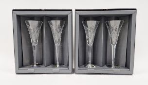 Two pairs of Waterford crystal 'Millennium Collection' cut wine glasses, each cut with radiating