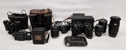 Collection of vintage cameras including a Pentax Asahi K1000, a Kodak Regent, a Eumig C4 8mm