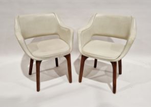 Pair of cream leather look 20th century Australian chairs, on teak curved cross framed legs,