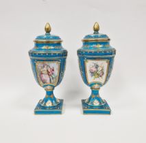 Pair of late 19th century Sevres-style turquoise ground vases and covers, each with pine cone