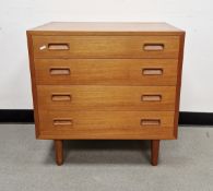 Mid-century teak chest of drawers by Poul Hundevad, the four drawers with recessed handles, raised