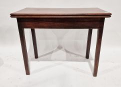 Georgian mahogany foldover tea table of rectangular form raised on square legs, approx. 72cm high