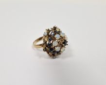 Gold-coloured metal, opal and blue stone cluster ring of four tiers (one opal missing)