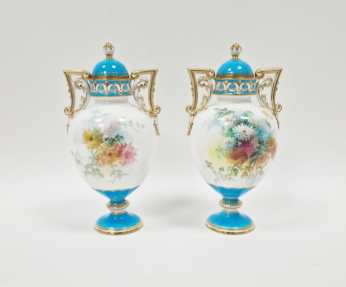 Pair of Minton bone china turquoise ground two-handled oviform vases with domed covers, circa